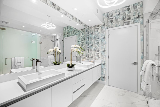 bathroom with vanity and a shower with shower door