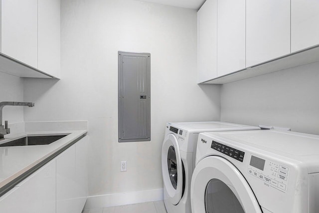 laundry room with sink, independent washer and dryer, cabinets, electric panel, and tile patterned flooring