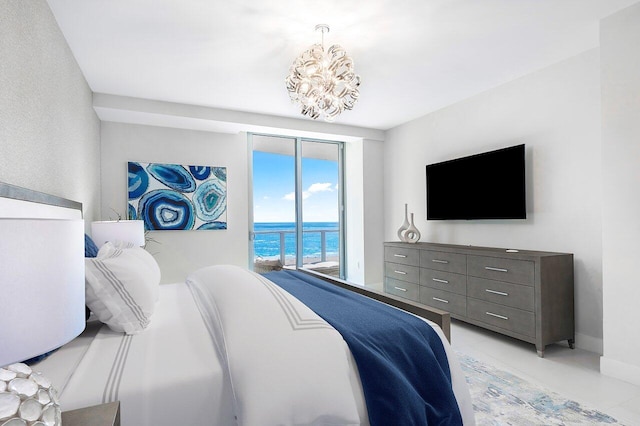 tiled bedroom featuring an inviting chandelier and access to exterior