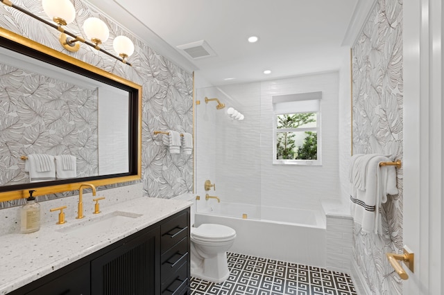 full bathroom with tiled shower / bath, vanity, toilet, and tile patterned flooring