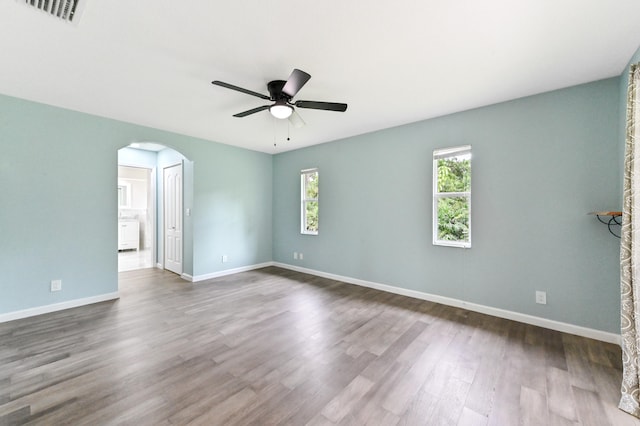 spare room featuring hardwood / wood-style floors and ceiling fan