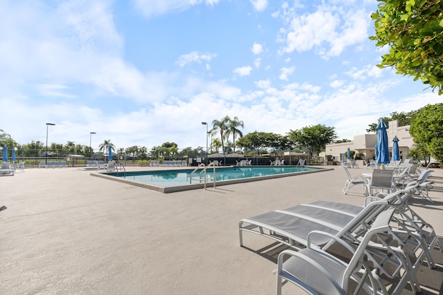 view of swimming pool featuring a patio area