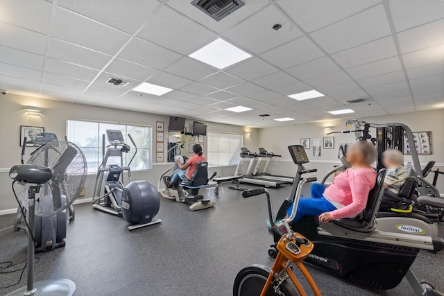 exercise room featuring a drop ceiling