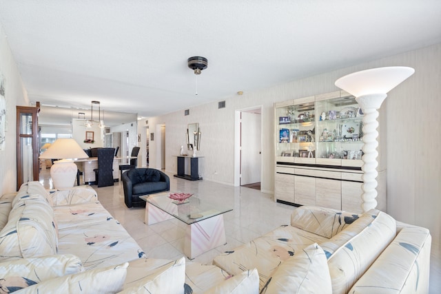 living room with light tile patterned floors