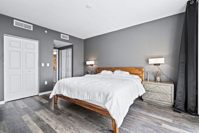 bedroom with dark wood-type flooring