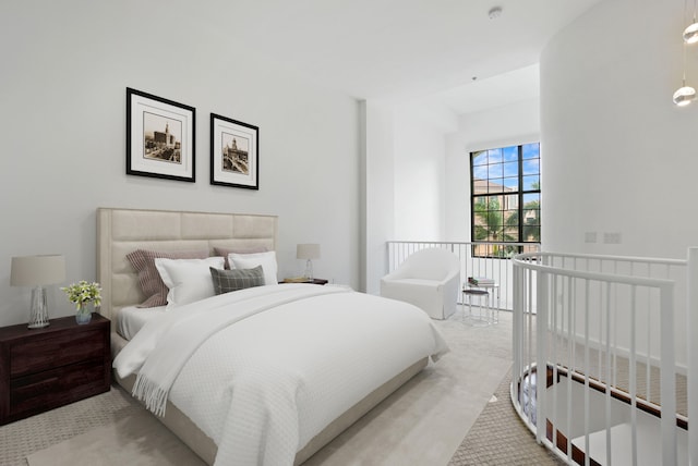 bedroom with light colored carpet