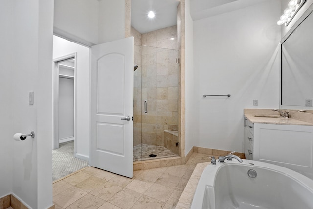 bathroom featuring vanity and shower with separate bathtub