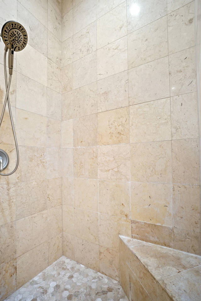 bathroom featuring tiled shower