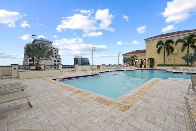 view of swimming pool featuring a patio