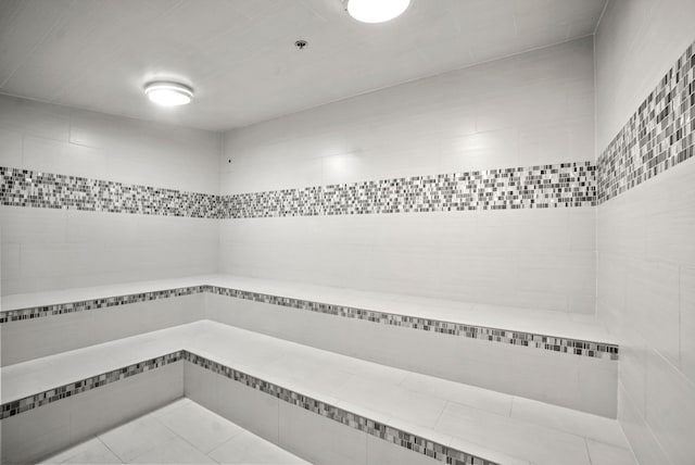 interior space with tile walls