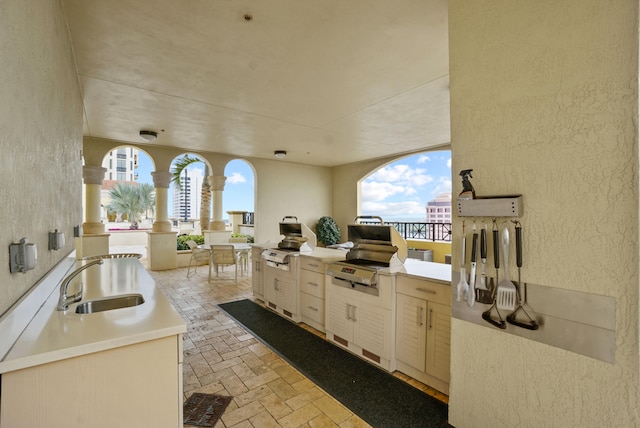 view of patio with sink and exterior kitchen