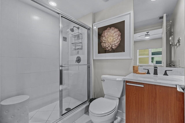 bathroom featuring toilet, vanity, and walk in shower