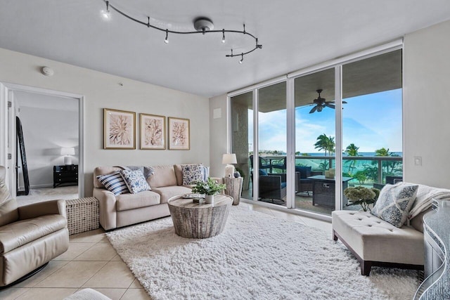 tiled living room featuring ceiling fan