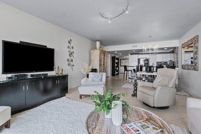 tiled living room with an inviting chandelier