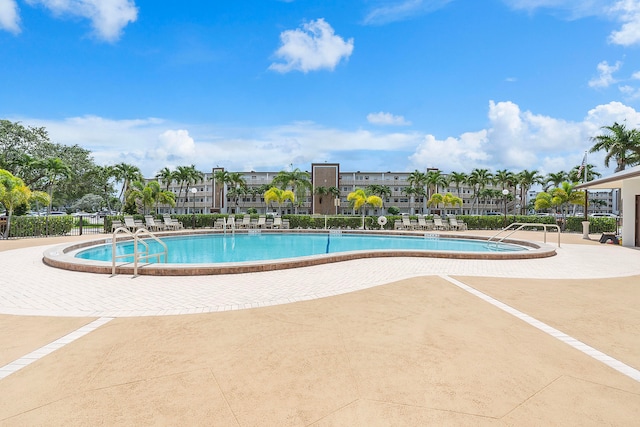 view of swimming pool featuring a patio area