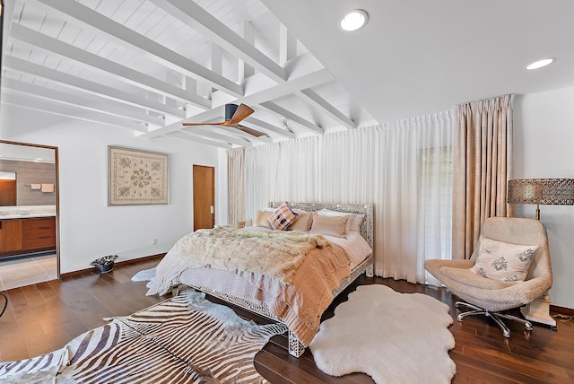 bedroom featuring ensuite bath, beam ceiling, and dark hardwood / wood-style flooring