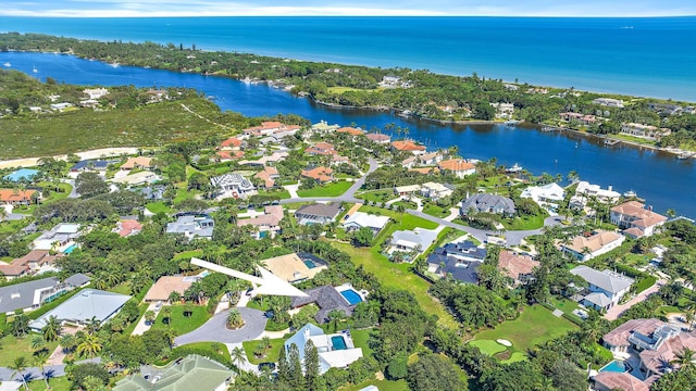 birds eye view of property with a residential view and a water view