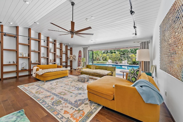 living room with lofted ceiling, wood finished floors, a ceiling fan, wood ceiling, and built in shelves
