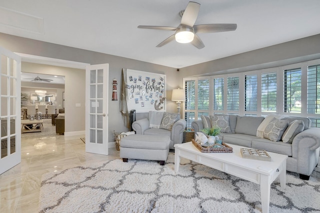 living room featuring french doors and ceiling fan