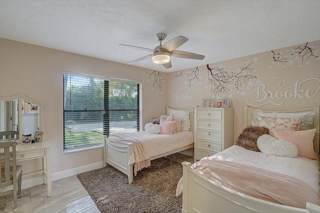 bedroom featuring multiple windows and ceiling fan