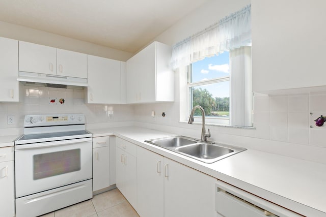 kitchen with white appliances, light tile patterned flooring, sink, white cabinetry, and decorative backsplash