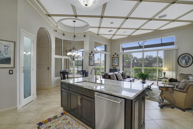 kitchen with light stone counters, a kitchen island with sink, dishwasher, sink, and coffered ceiling