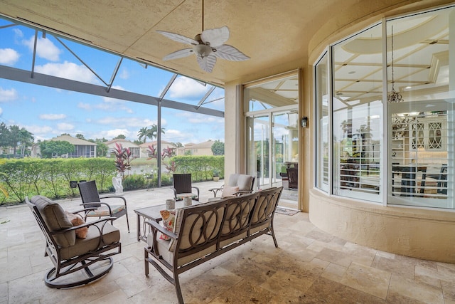 sunroom / solarium with ceiling fan and a wealth of natural light