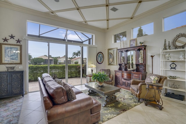 living room featuring ornamental molding, a high ceiling, and light tile patterned flooring