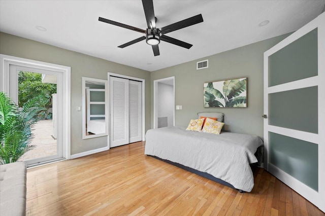 bedroom featuring access to exterior, ceiling fan, a closet, and wood-type flooring