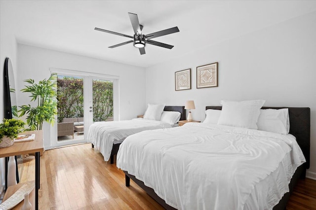 bedroom with access to exterior, wood-type flooring, french doors, and ceiling fan