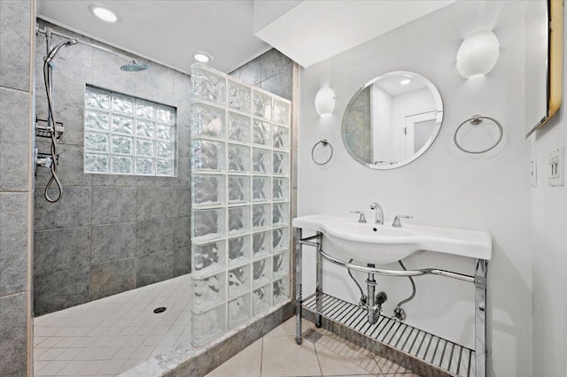 bathroom with tile patterned flooring and tiled shower