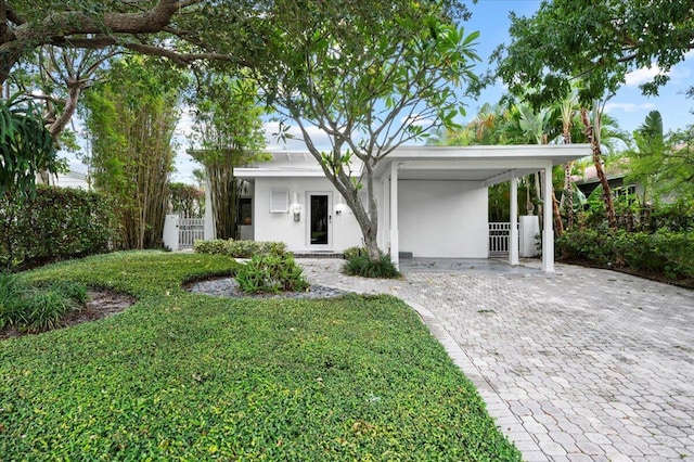 view of front of home with a carport