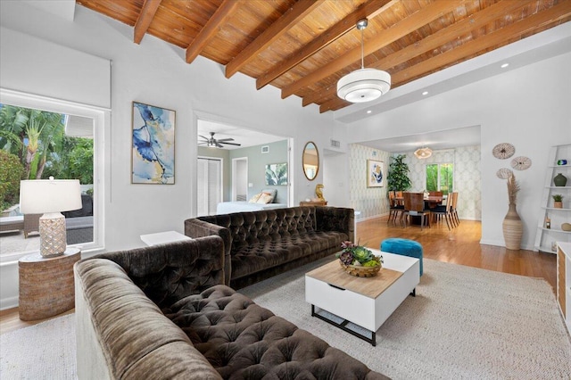 living room with ceiling fan, wooden ceiling, a healthy amount of sunlight, and light wood-type flooring