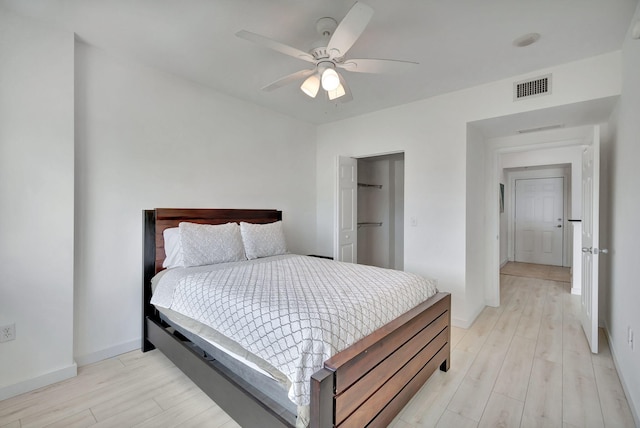 100 NE 6th St Unit 505, Boynton Beach, FL 33435 - bedroom with light wood-style flooring, visible vents, baseboards, and ceiling fan
