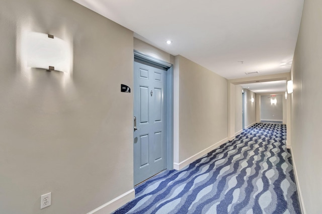 hallway with carpet flooring