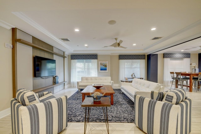 living room featuring light hardwood / wood-style floors, crown molding, and ceiling fan