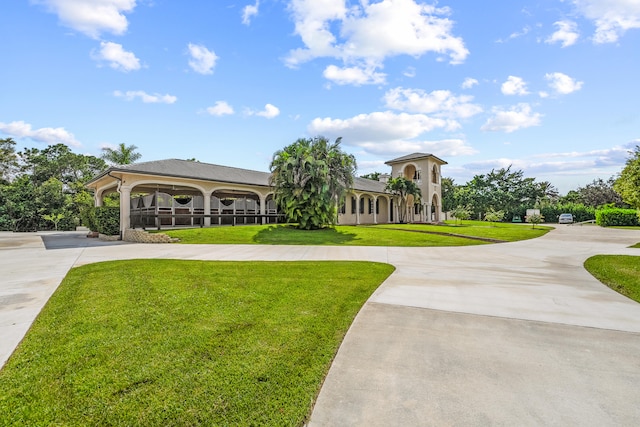 view of property's community with a lawn