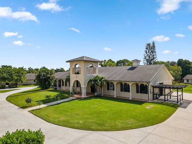 mediterranean / spanish-style house with a front yard