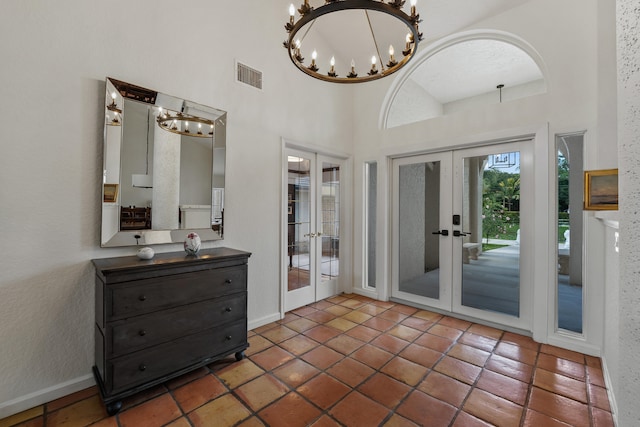 interior space with tile patterned floors, french doors, and vanity