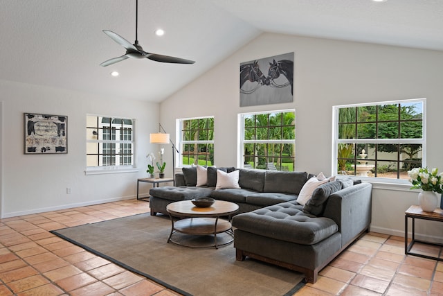 living room featuring ceiling fan, light tile patterned flooring, and high vaulted ceiling