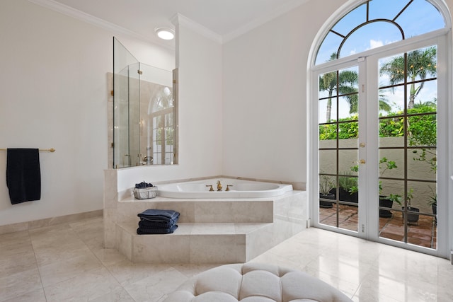 bathroom featuring separate shower and tub, ornamental molding, and french doors