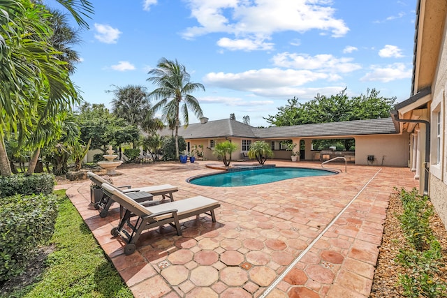 view of swimming pool featuring a patio