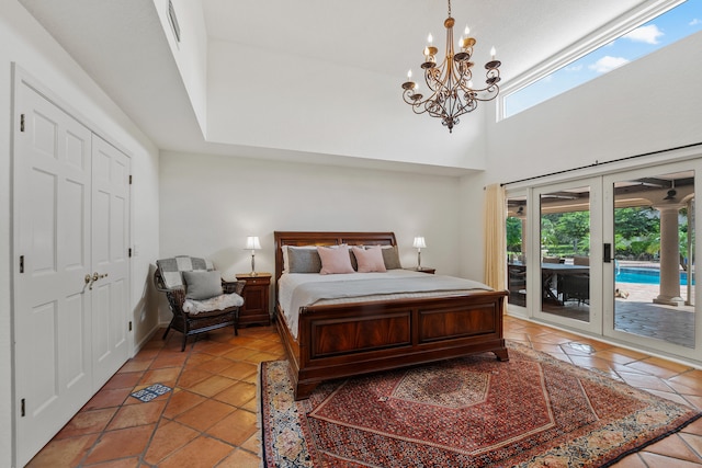 tiled bedroom featuring french doors, access to exterior, a closet, and multiple windows