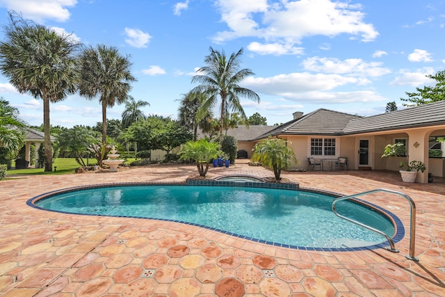 view of swimming pool with a patio