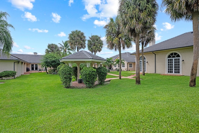 surrounding community featuring a gazebo and a lawn