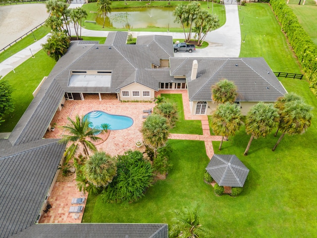 birds eye view of property with a water view