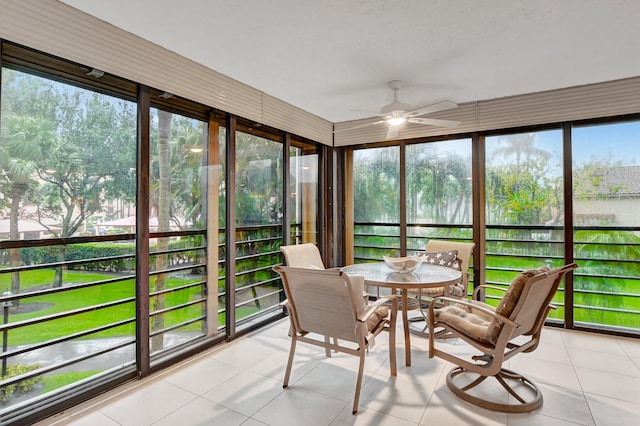 sunroom featuring ceiling fan