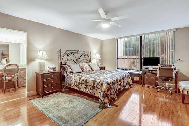 bedroom with light wood-type flooring and ceiling fan