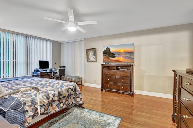 bedroom featuring ceiling fan and light wood-type flooring