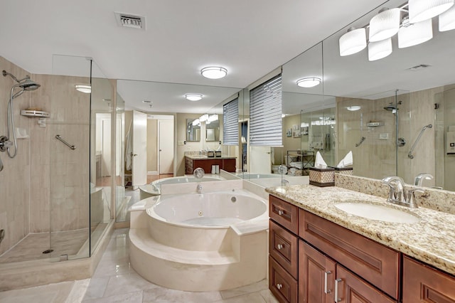 bathroom with vanity, separate shower and tub, and tile patterned flooring